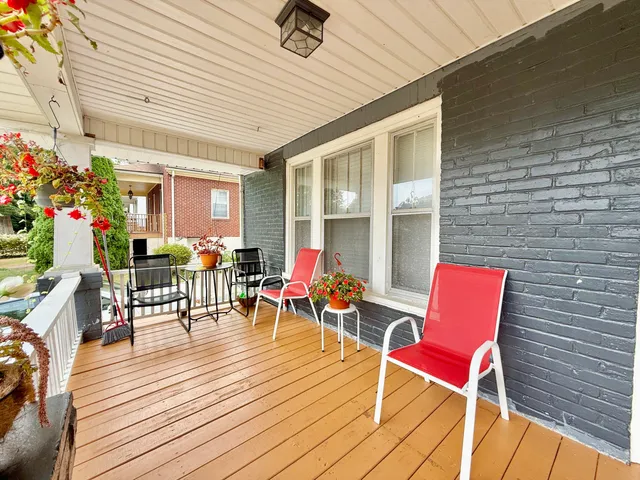 a view of a porch with wooden floor and outdoor space