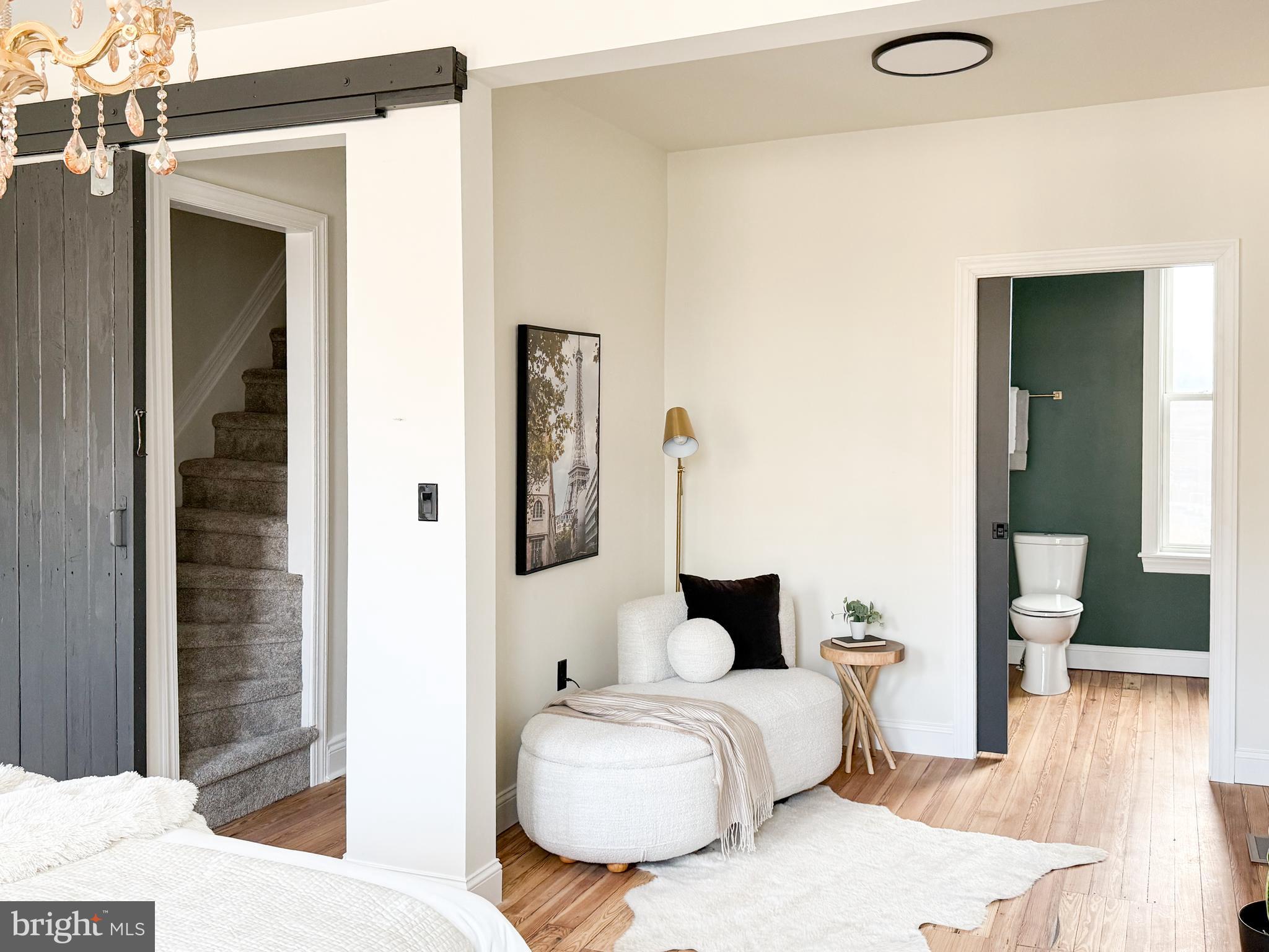 328 Walnut Street Columbia, PA 17512 - Photo 16 of 28 a bedroom with a bed and wooden floor