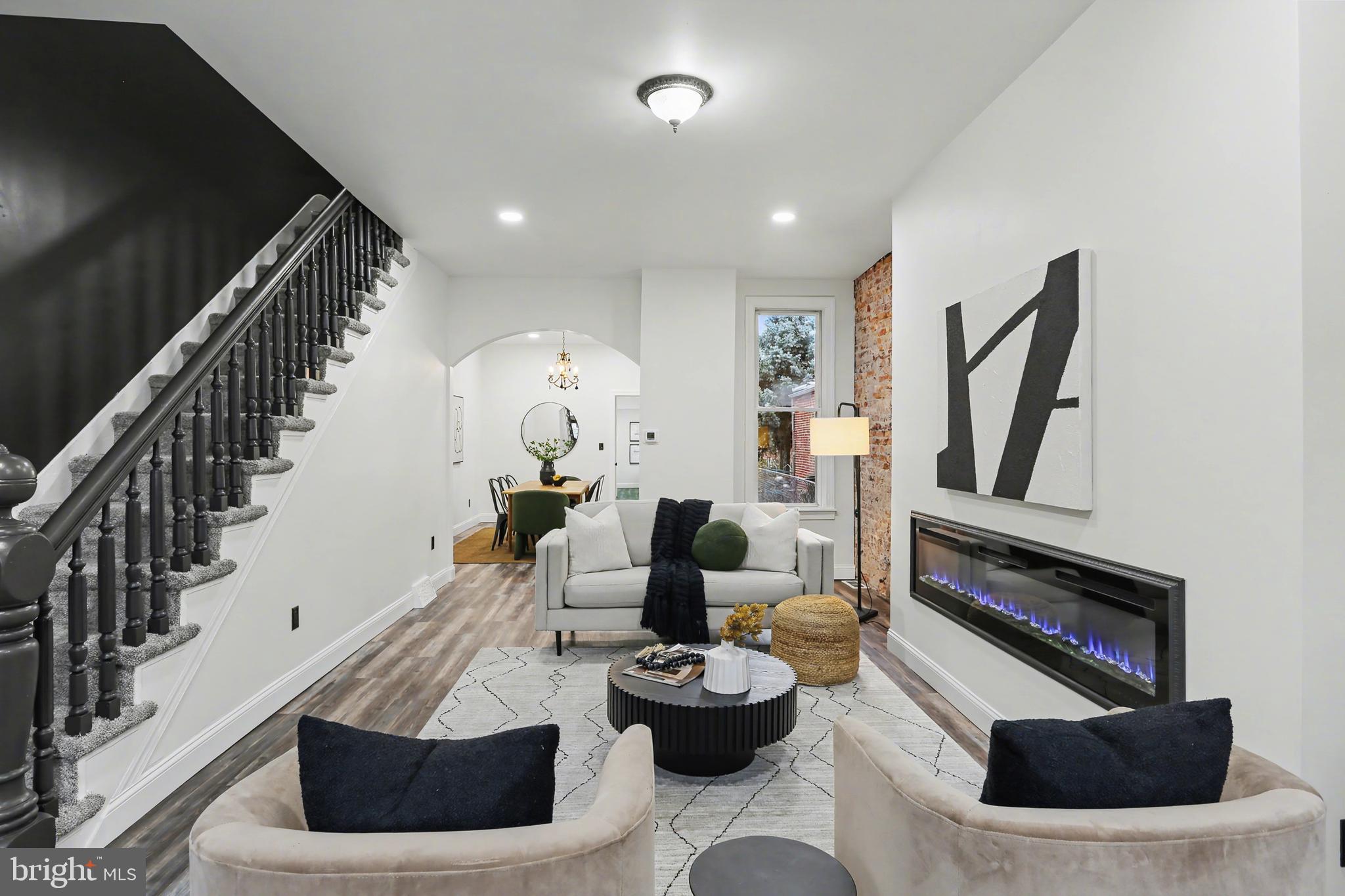 328 Walnut Street Columbia, PA 17512 - Photo 5 of 28 a living room with furniture and a fireplace