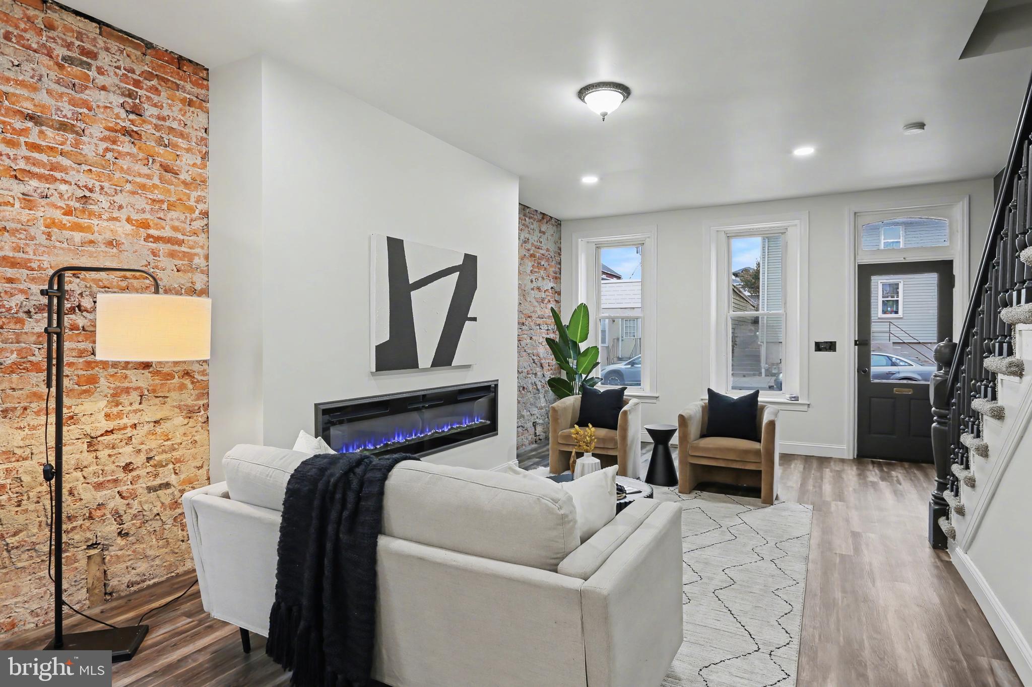 328 Walnut Street Columbia, PA 17512 - Photo 6 of 28 a living room with furniture and a fireplace