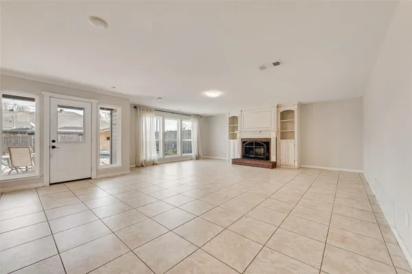 a kitchen with stainless steel appliances granite countertop a sink counter space cabinets and a stove