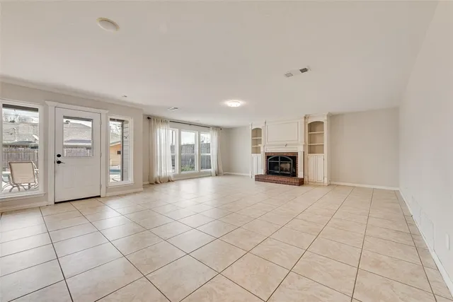 a kitchen with stainless steel appliances granite countertop a sink counter space cabinets and a stove
