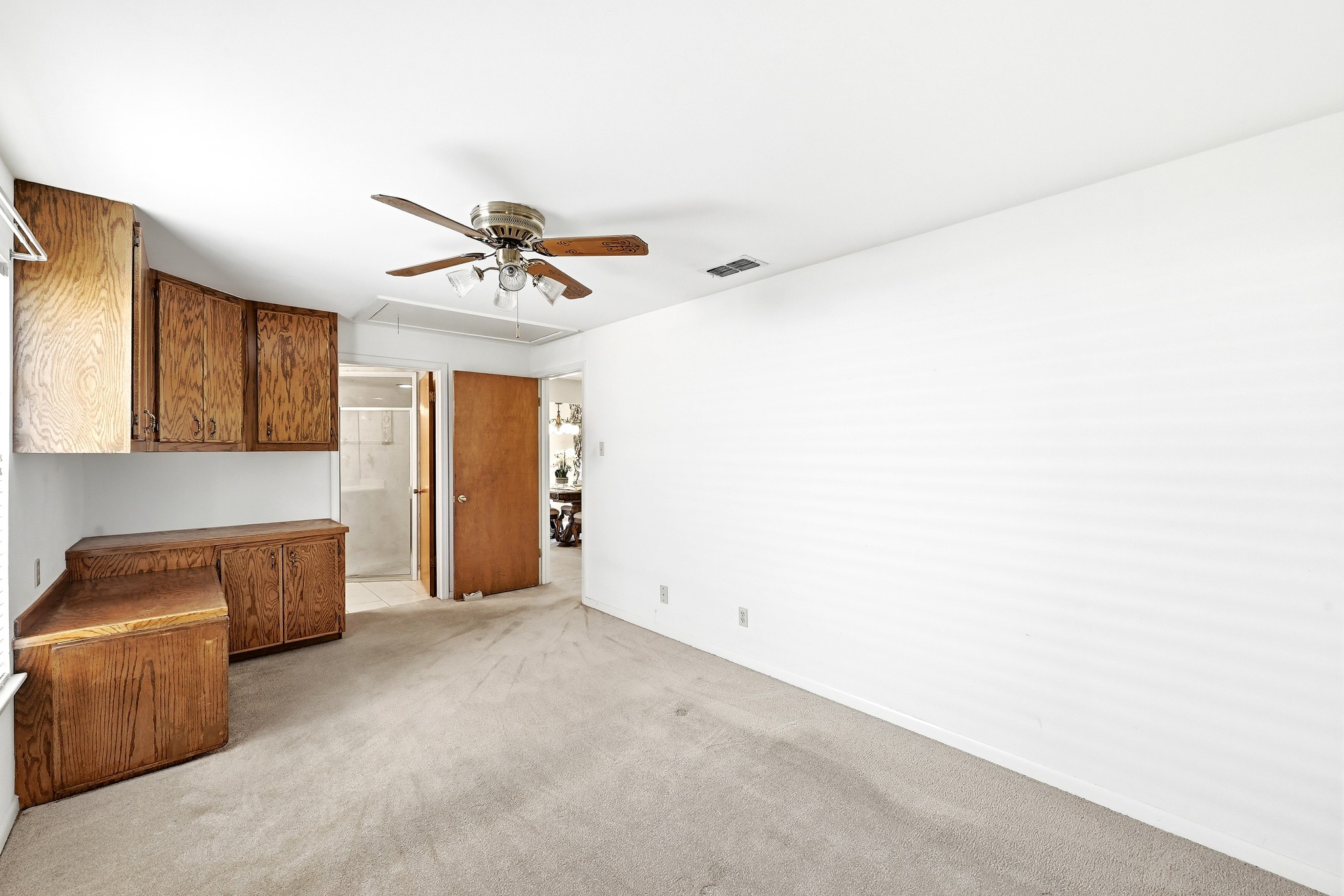 4619 Banister Lane Austin, TX 78745 - Photo 18 of 34 Unfurnished living room with a ceiling fan and light carpet