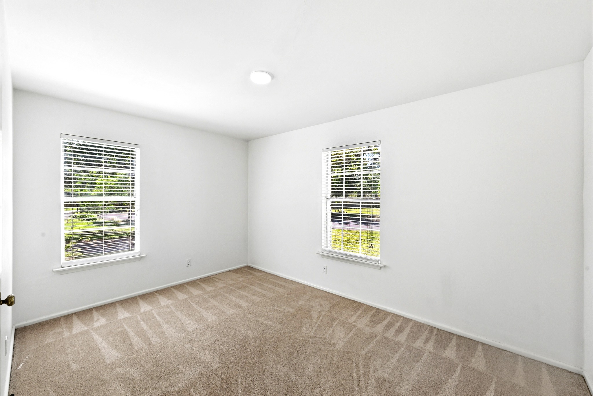 4619 Banister Lane Austin, TX 78745 - Photo 21 of 34 Unfurnished room featuring light colored carpet