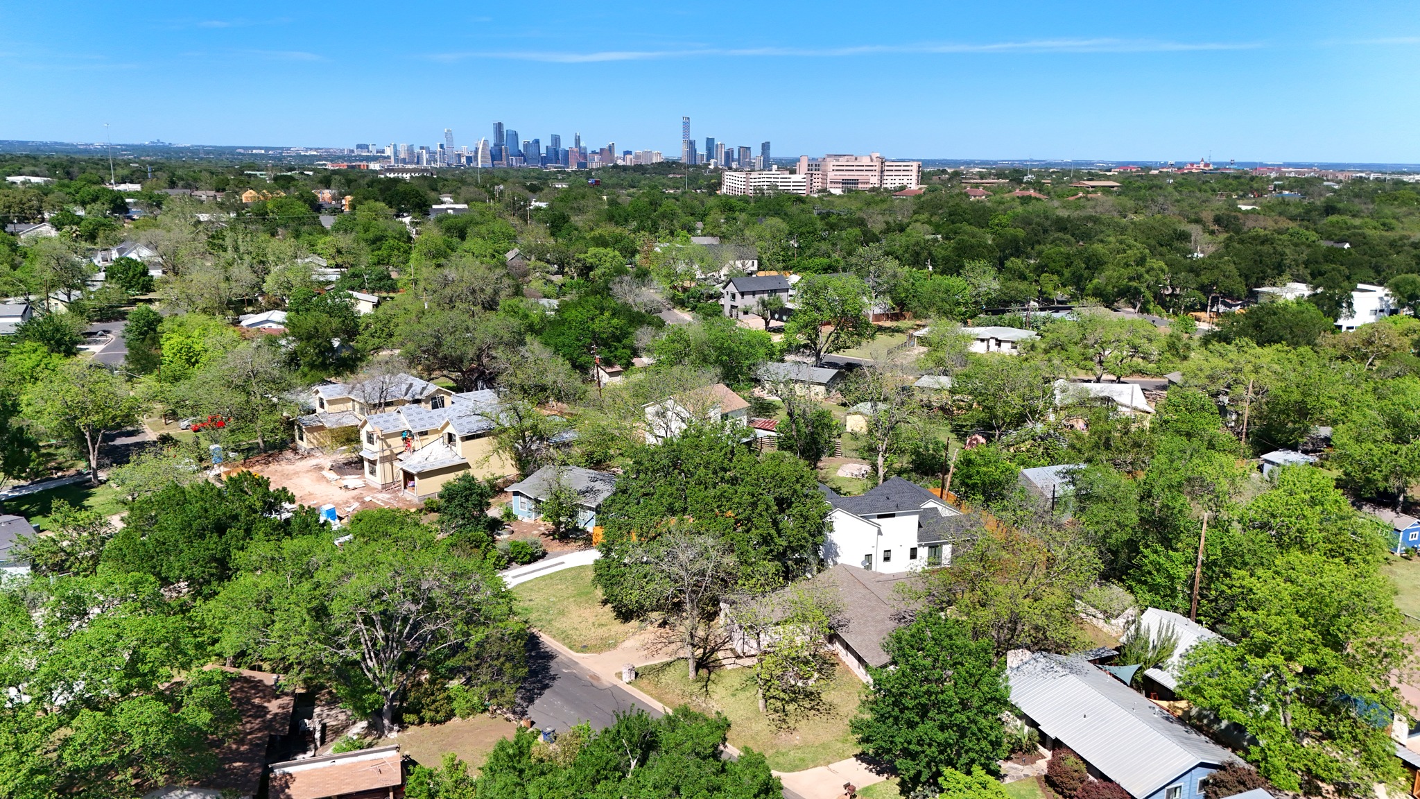4619 Banister Lane Austin, TX 78745 - Photo 34 of 34 Aerial perspective of suburban area with skyline and a tree filled landscape