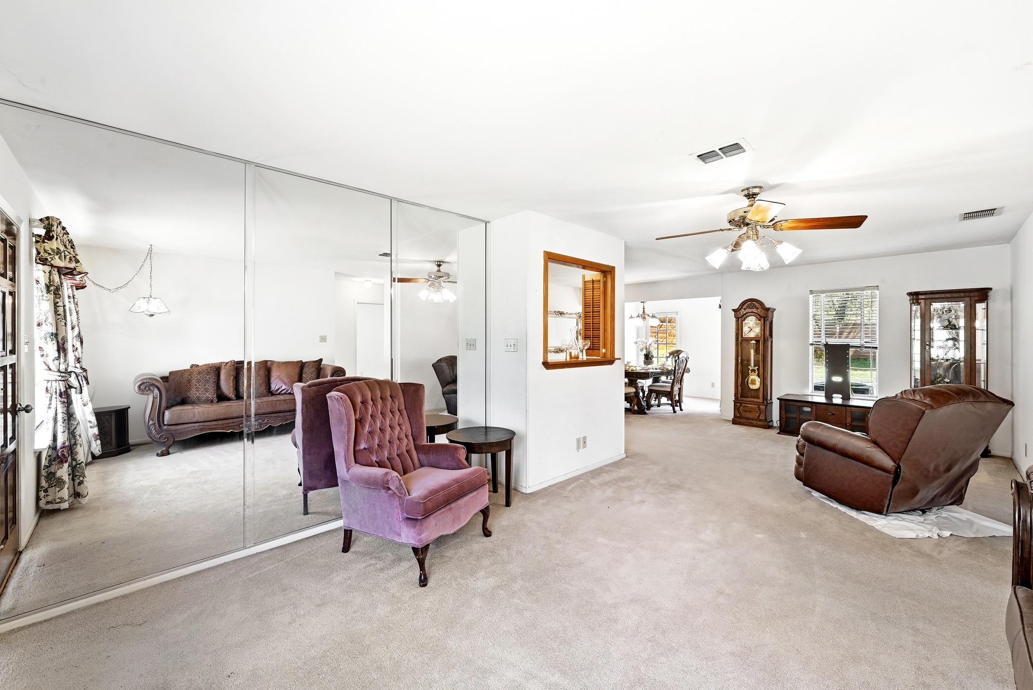 4619 Banister Lane Austin, TX 78745 - Photo 6 of 34 Living room with ceiling fan and light colored carpet