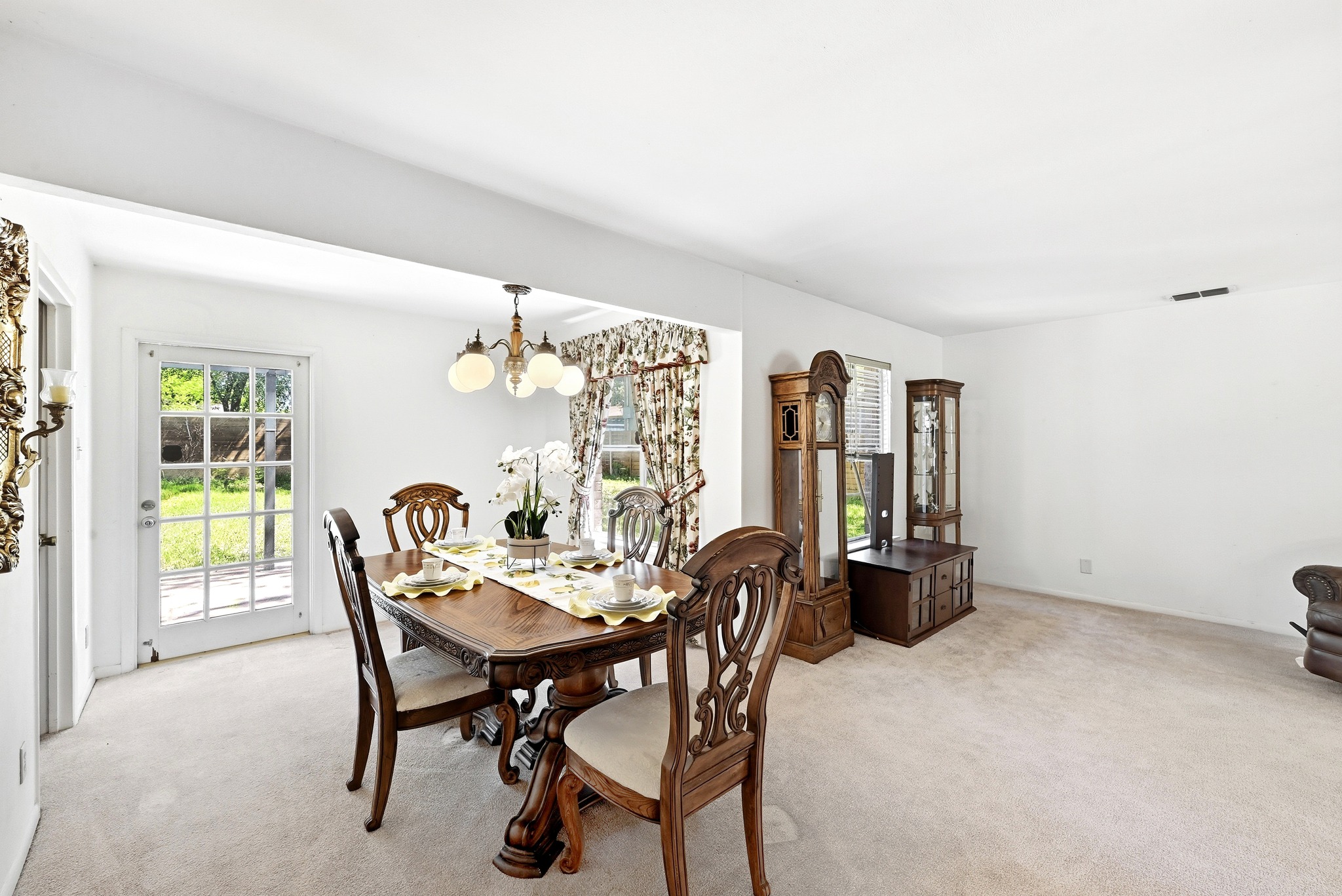 4619 Banister Lane Austin, TX 78745 - Photo 10 of 34 Dining space featuring light carpet and suspended lighting