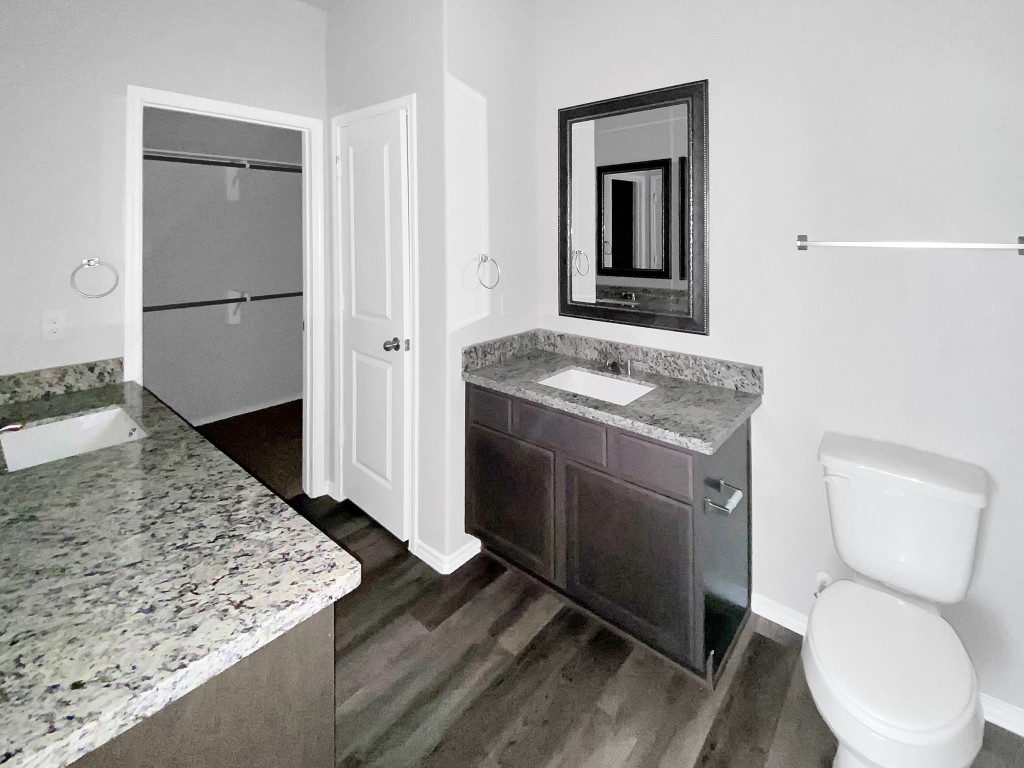 1202 St Lawrence River Road Montgomery, TX 77316 - Photo 11 of 21 a bathroom with a toilet sink and mirror