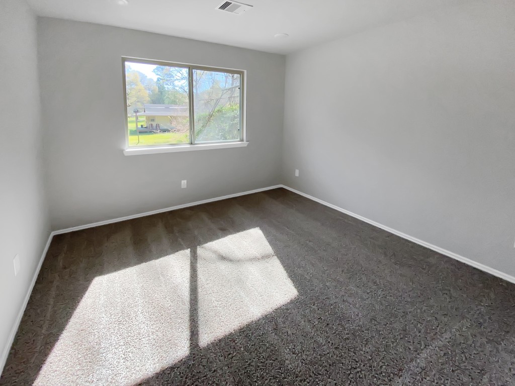 1202 St Lawrence River Road Montgomery, TX 77316 - Photo 18 of 21 an empty room with a window
