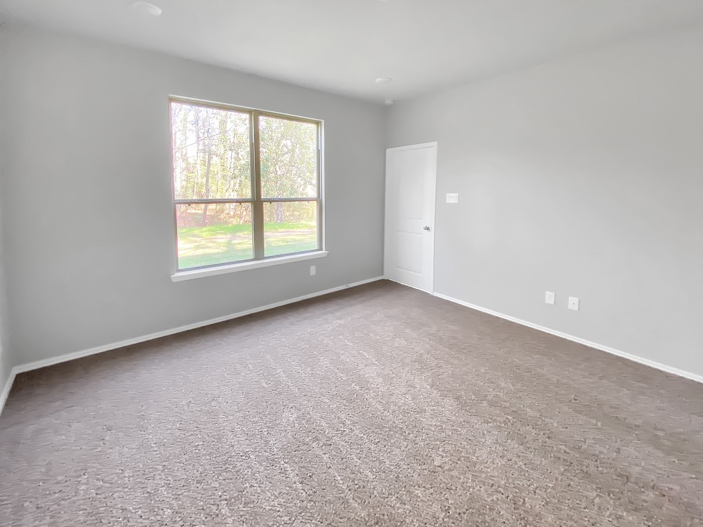 1202 St Lawrence River Road Montgomery, TX 77316 - Photo 10 of 21 an empty room with a window