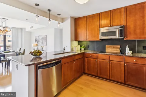 a utility room with sink dryer and washer