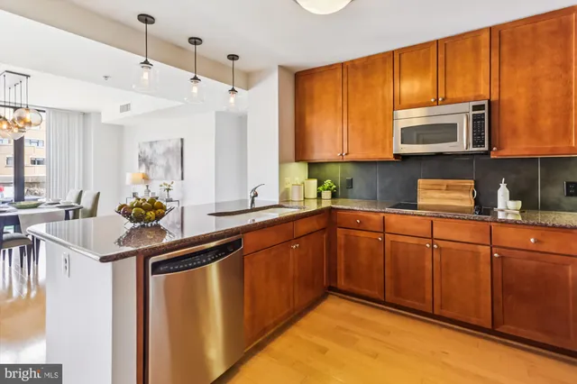 a utility room with sink dryer and washer