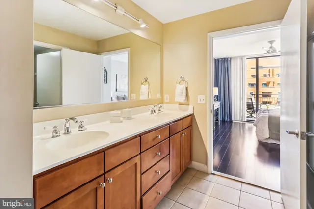 a bedroom with a large bed and a large window