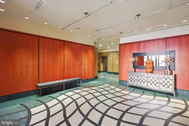 a front view of a building with a garden