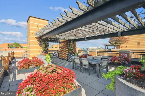 a view of a dining room with furniture wooden floor and a rug