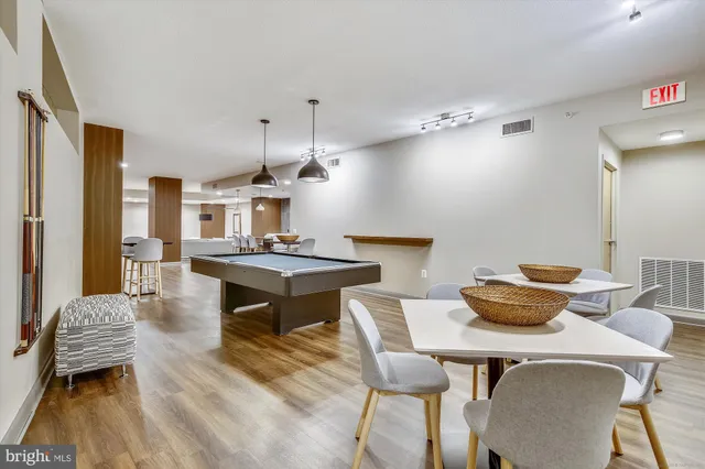 a view of a building with a lot of people on a street