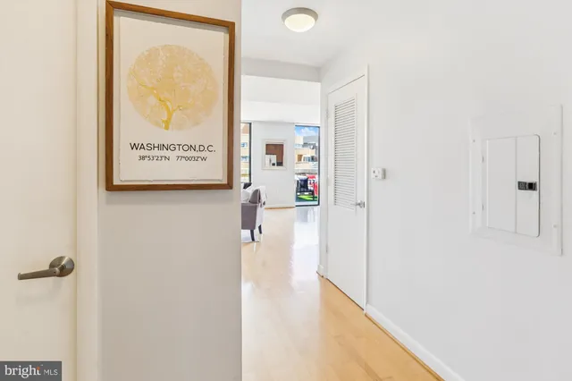 a view of a living room with furniture and a window