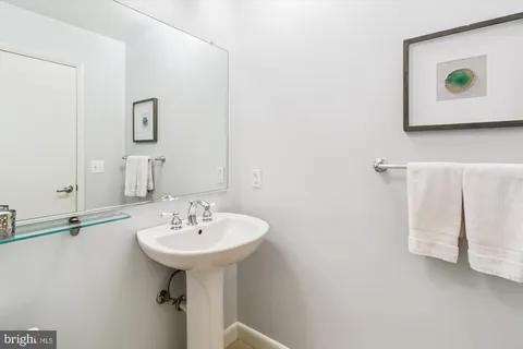a kitchen with stainless steel appliances granite countertop a sink and a refrigerator