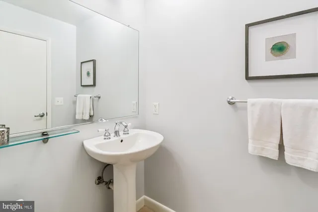 a kitchen with stainless steel appliances granite countertop a sink and a refrigerator