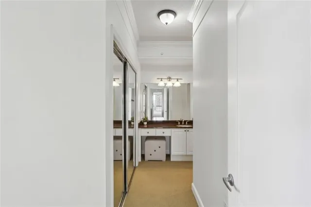 a en suite bathroom with a sink a mirror and a bathtub