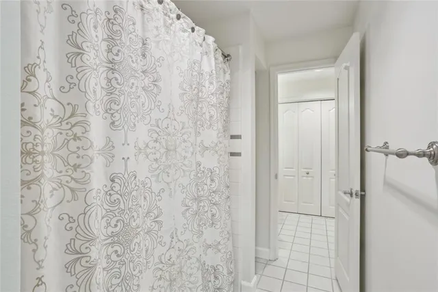 a bathroom with a shower curtain