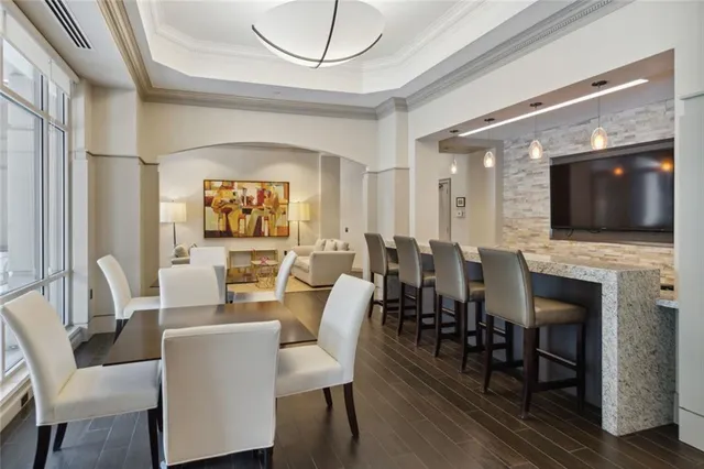 a view of a dining room with furniture window and wooden floor