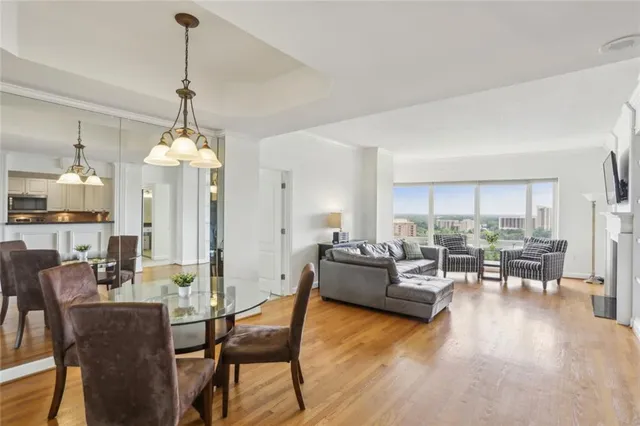 a view of a dining room with furniture window and wooden floor