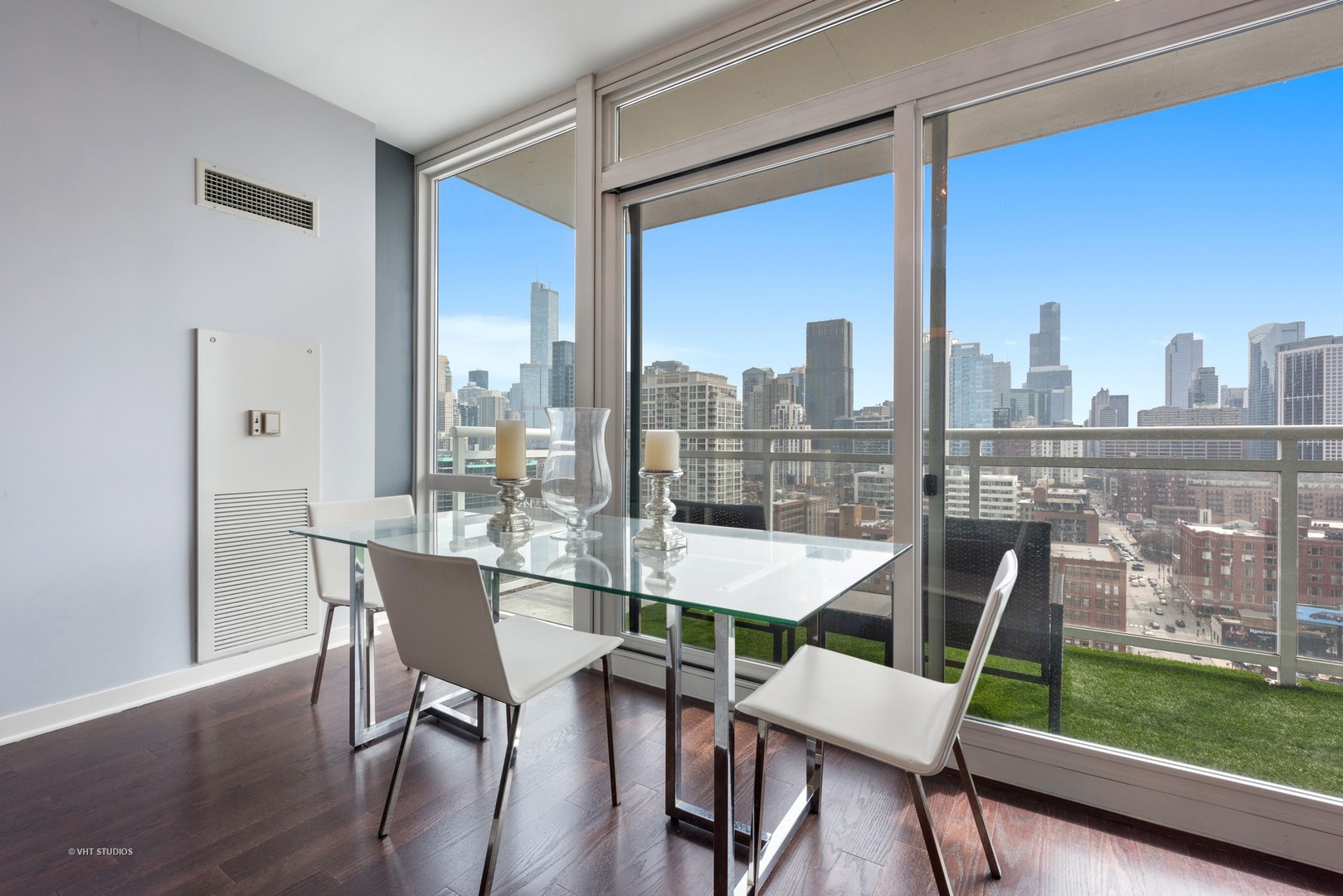 757 North Orleans Street, Unit 1812 Chicago, IL 60654 - Photo 4 of 17 a dining room with furniture and a floor to ceiling window