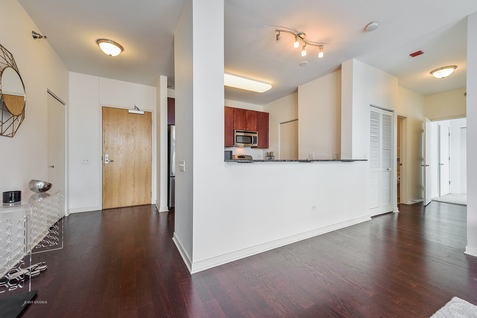757 North Orleans Street, Unit 1812 Chicago, IL 60654 - Photo 7 of 17 a view of a kitchen cabinets and wooden floor