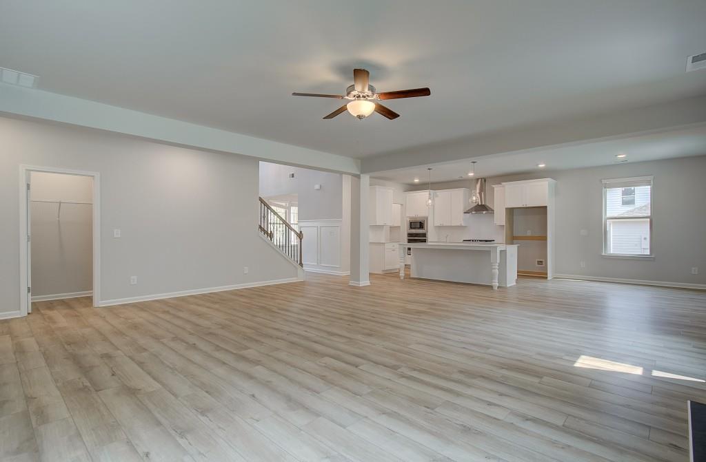 624 Sidney Court Stockbridge, GA 30281 - Photo 14 of 29 a view of empty room with wooden floor and ceiling fan