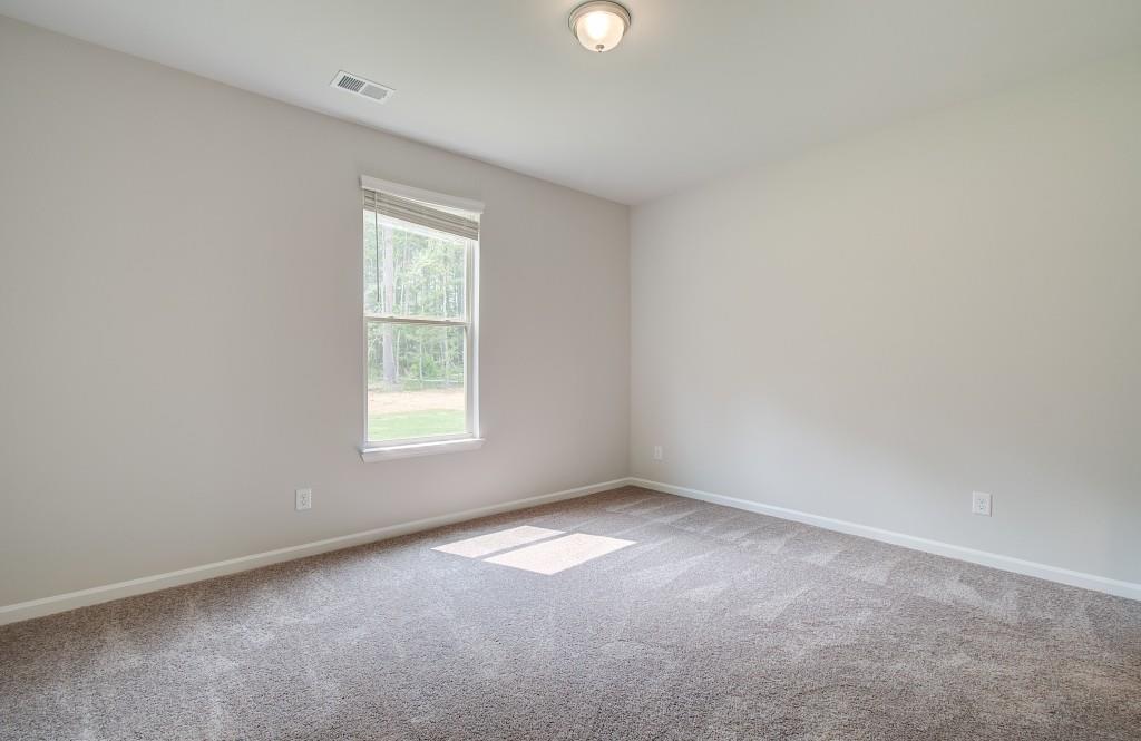 624 Sidney Court Stockbridge, GA 30281 - Photo 16 of 29 an empty room with a window