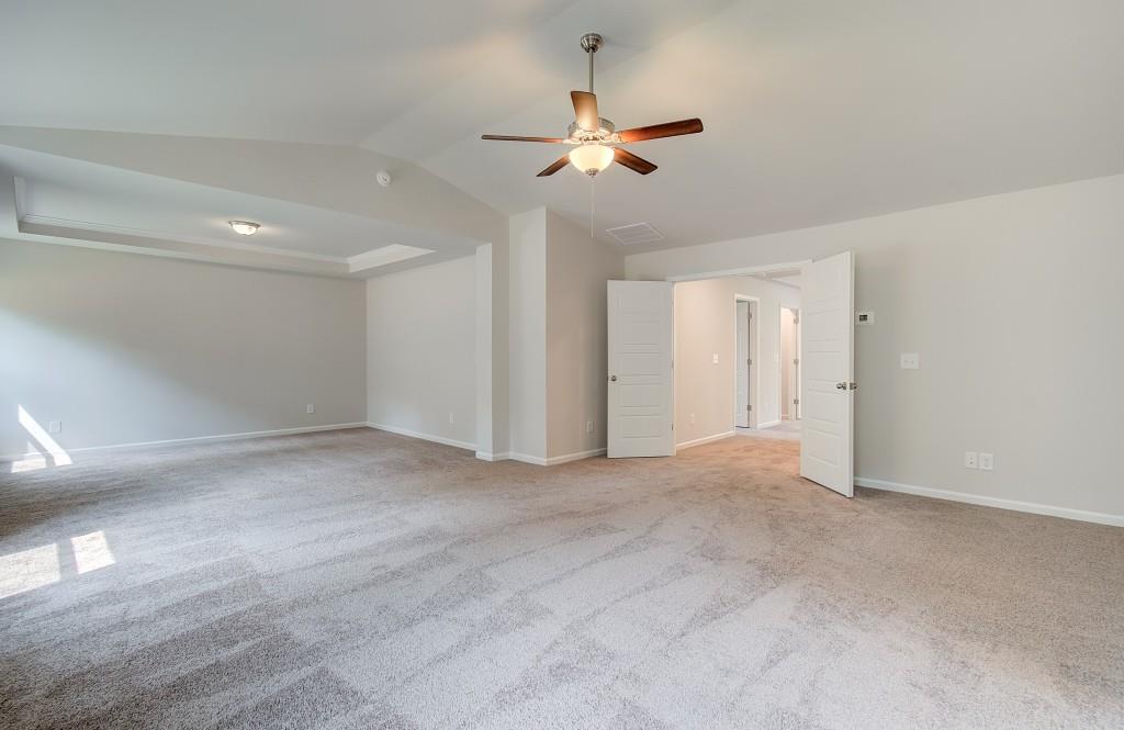 624 Sidney Court Stockbridge, GA 30281 - Photo 23 of 29 a view of an empty room with a ceiling fan