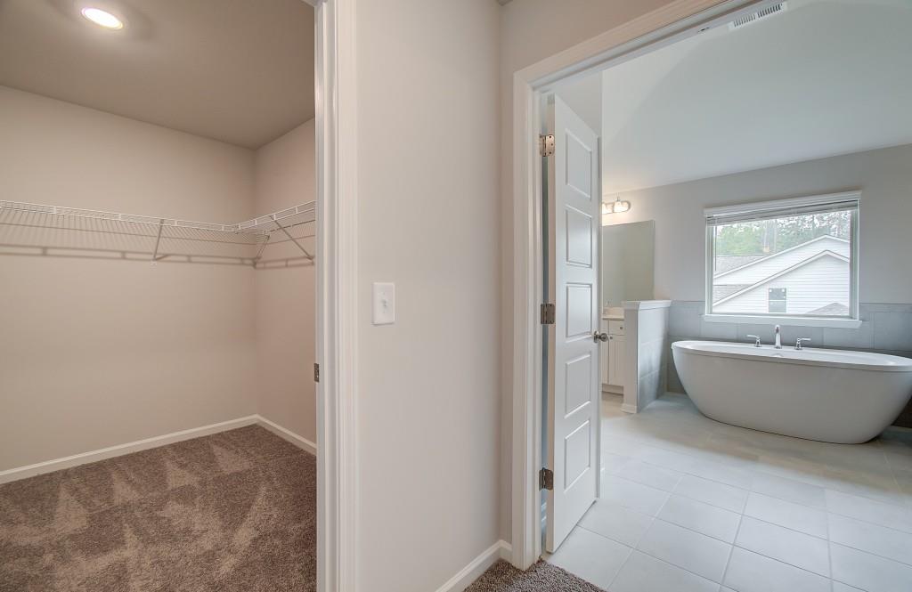 624 Sidney Court Stockbridge, GA 30281 - Photo 25 of 29 a bathroom with a tub and shower
