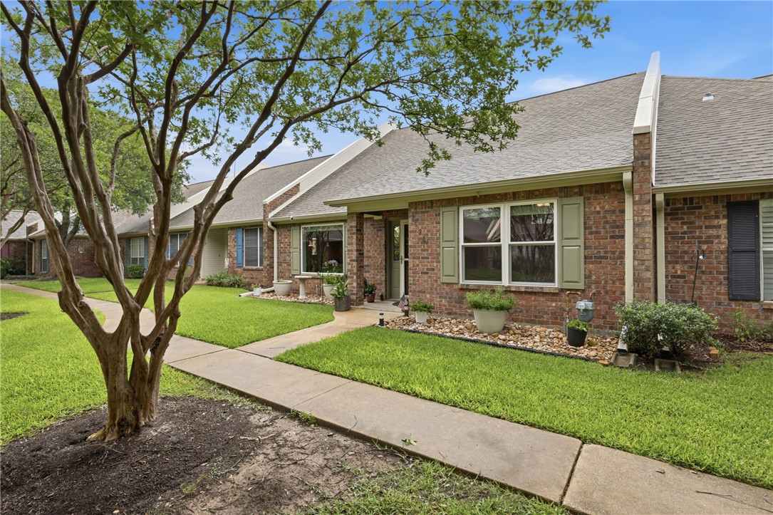 1520 Bennett Street Bryan, TX 77802 - Photo 2 of 24 a view of a house with a yard