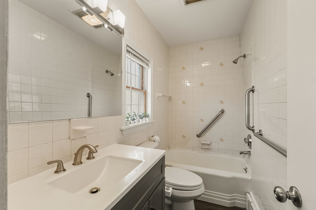 70 Nagle Street Springfield, MA 01151 - Photo 14 of 23 a bathroom with a sink a toilet and a bathtub