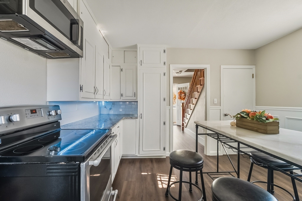70 Nagle Street Springfield, MA 01151 - Photo 3 of 23 a kitchen that has a table and chairs in it
