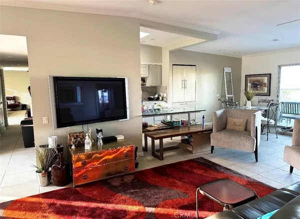 a living room with furniture flat screen tv and a fireplace