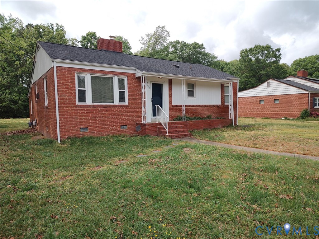 front view of house with a yard