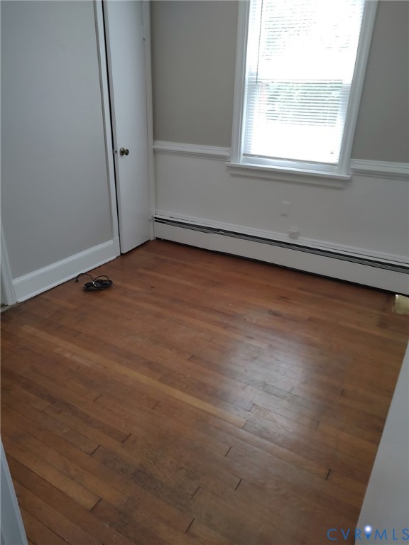 5310 Raleigh Road Henrico, VA 23231 - Photo 13 of 15 an empty room with wooden floor and windows