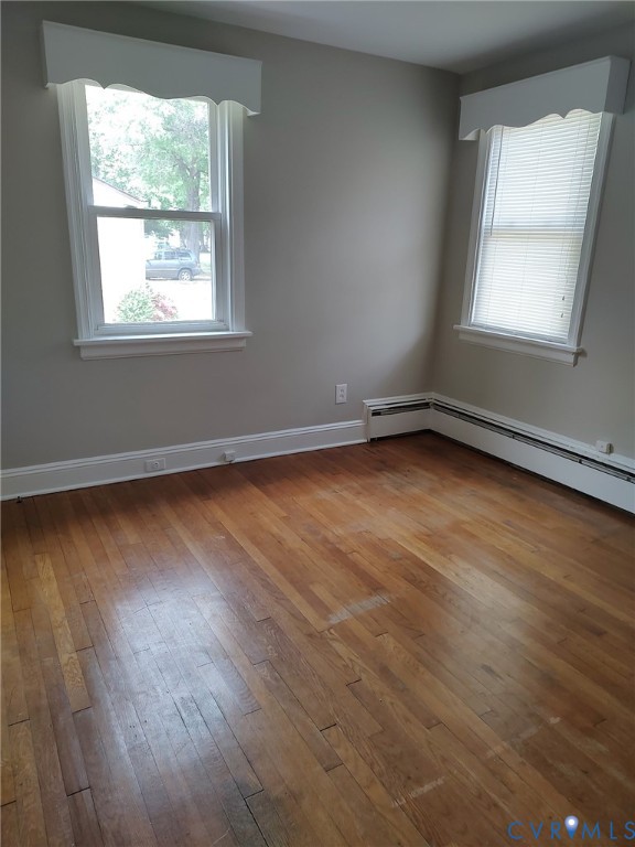 5310 Raleigh Road Henrico, VA 23231 - Photo 14 of 15 an empty room with wooden floor and windows