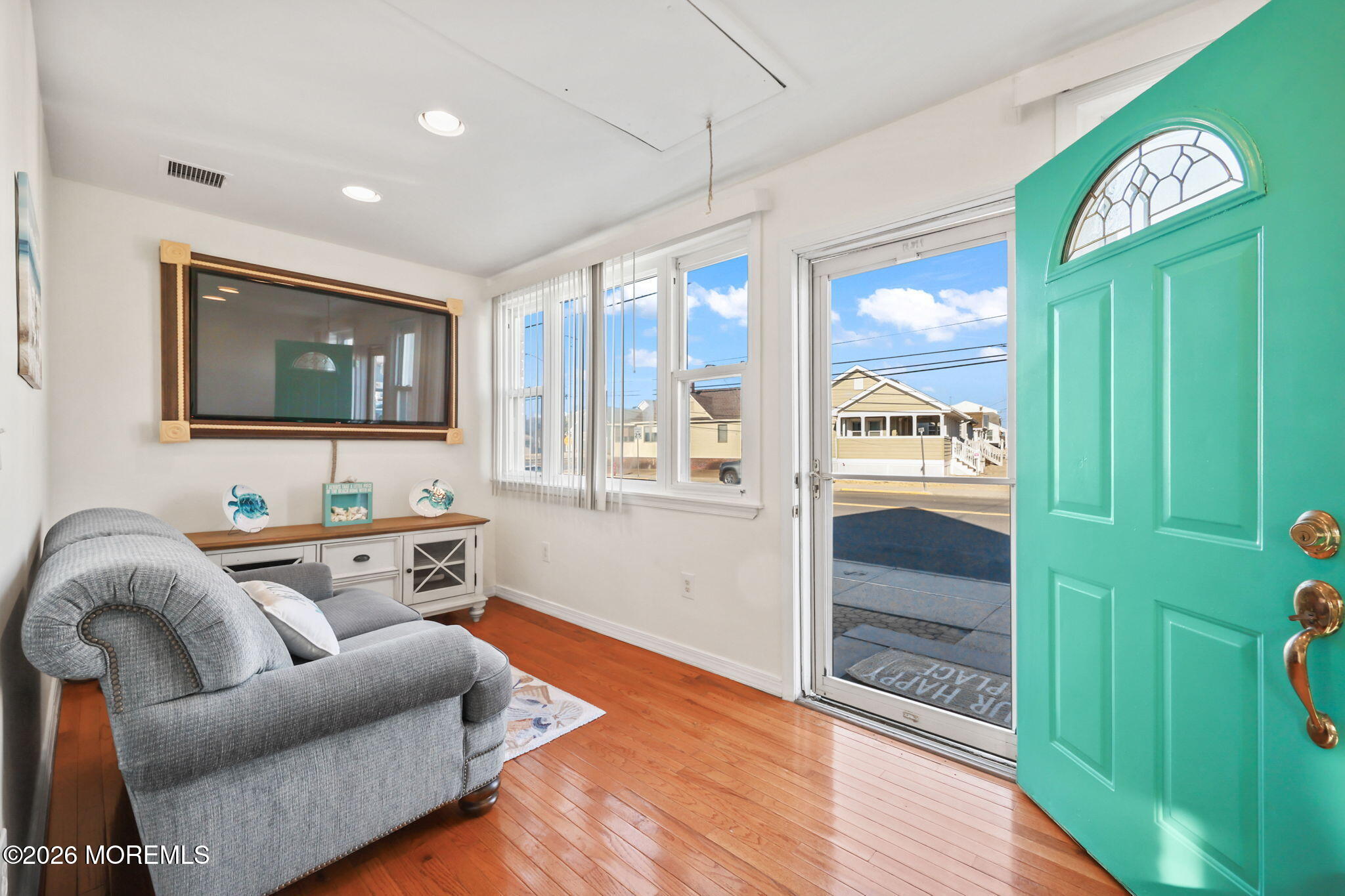211 Ocean Avenue Point Pleasant Beach, NJ 08742 - Photo 12 of 60 a living room with furniture and a gate