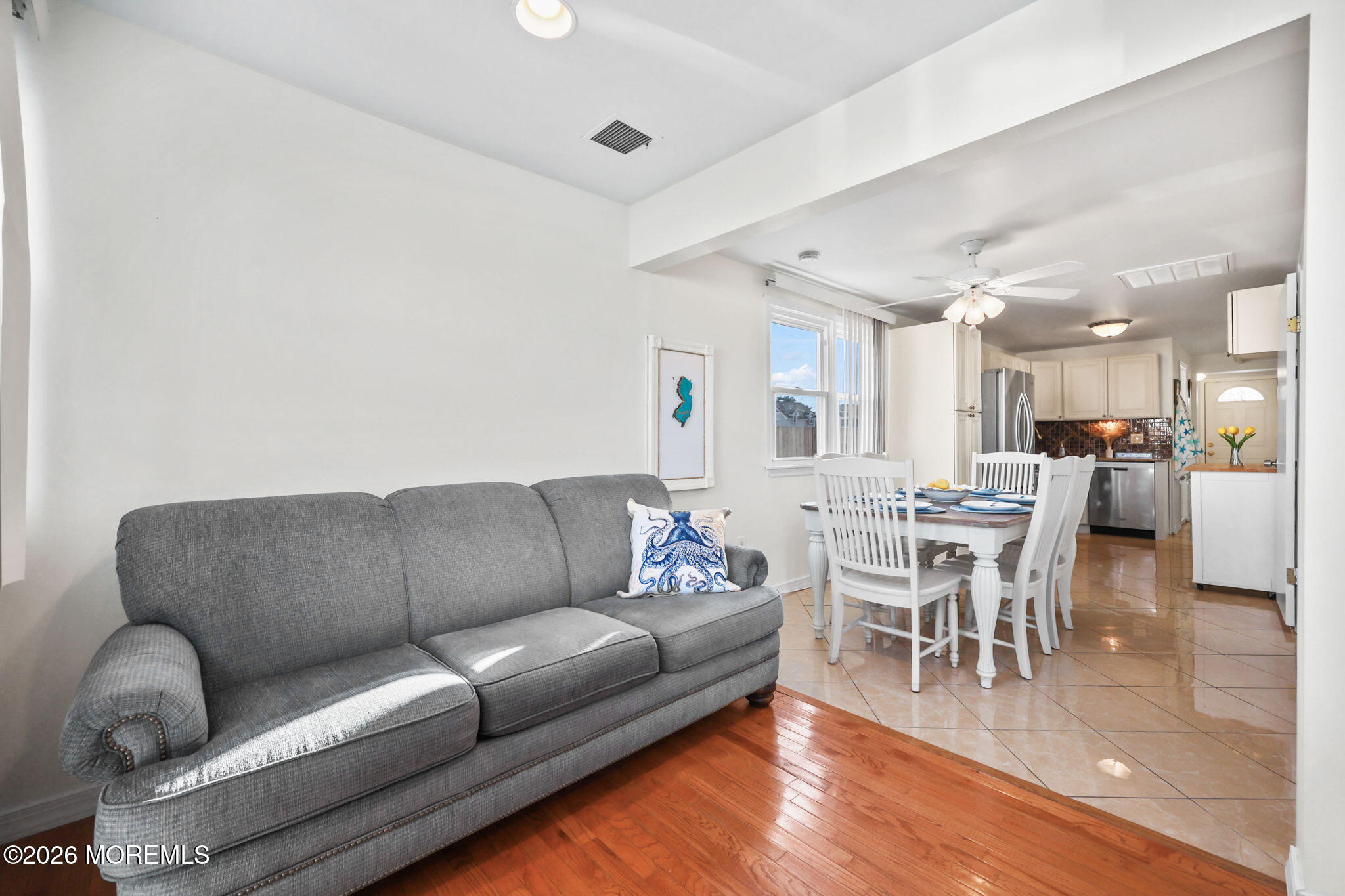 211 Ocean Avenue Point Pleasant Beach, NJ 08742 - Photo 15 of 60 a living room with furniture wooden floor and a kitchen