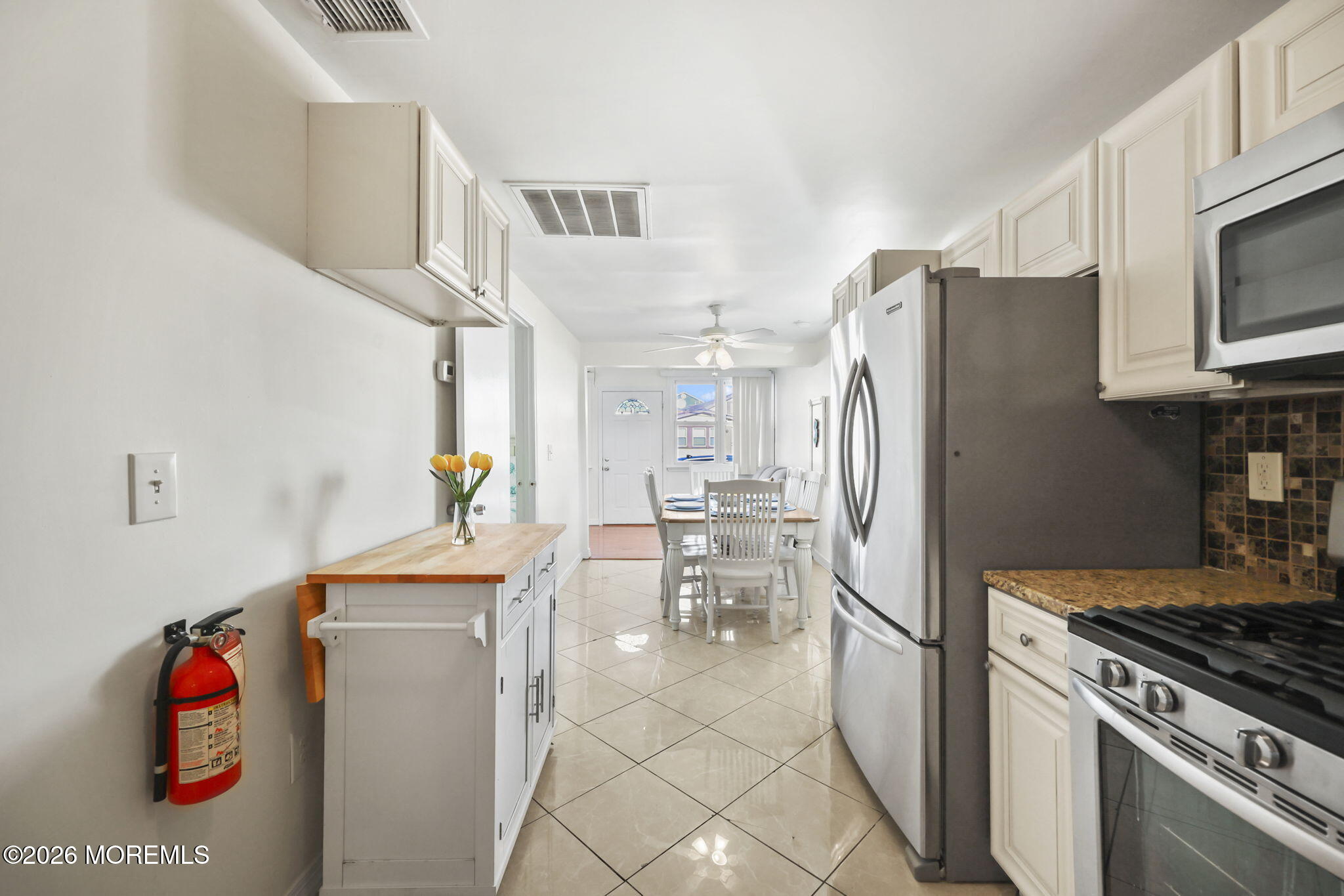 211 Ocean Avenue Point Pleasant Beach, NJ 08742 - Photo 21 of 60 a kitchen with stainless steel appliances granite countertop a refrigerator and a stove top oven