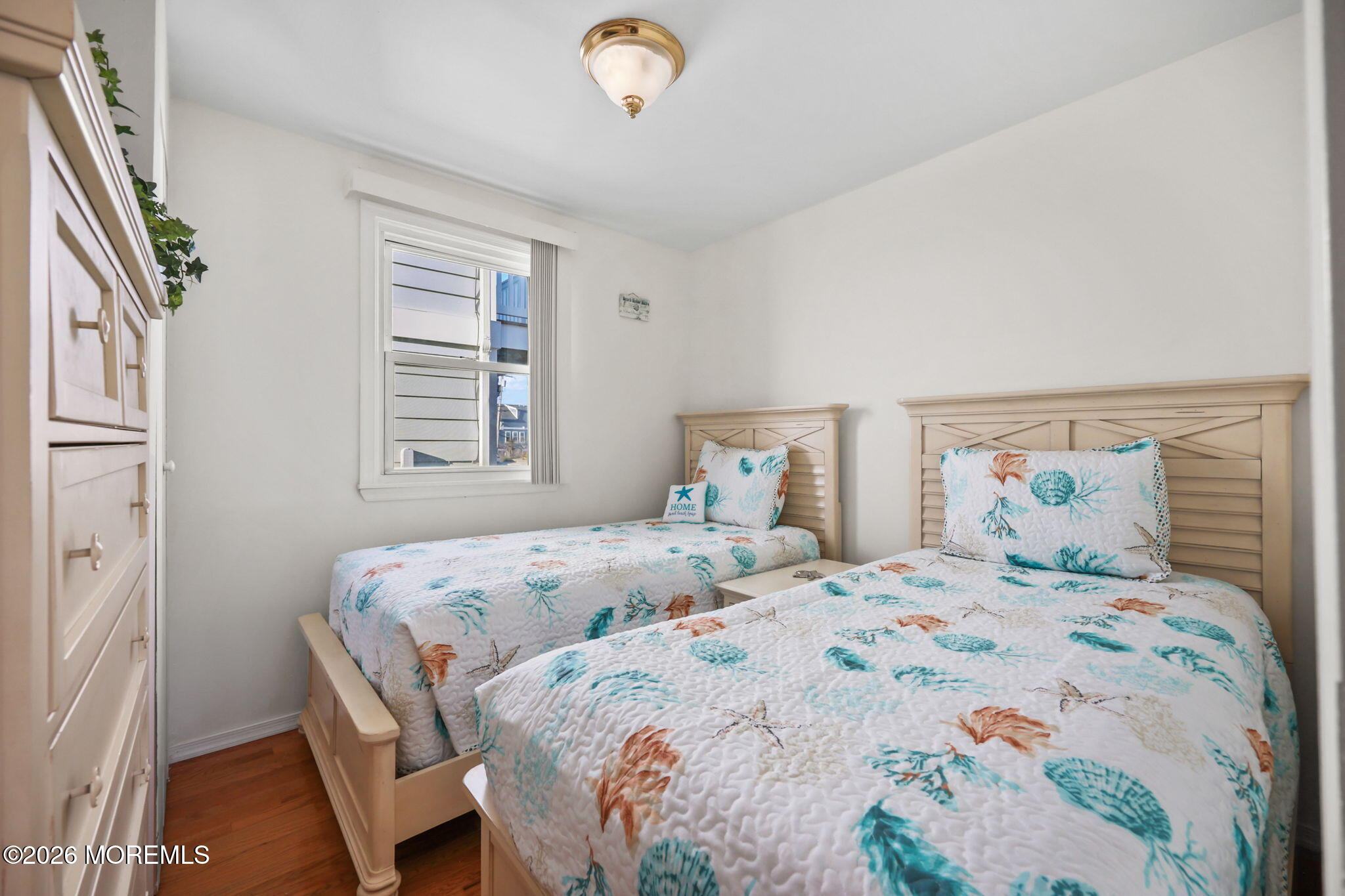 211 Ocean Avenue Point Pleasant Beach, NJ 08742 - Photo 22 of 60 a bedroom with a bed and a window