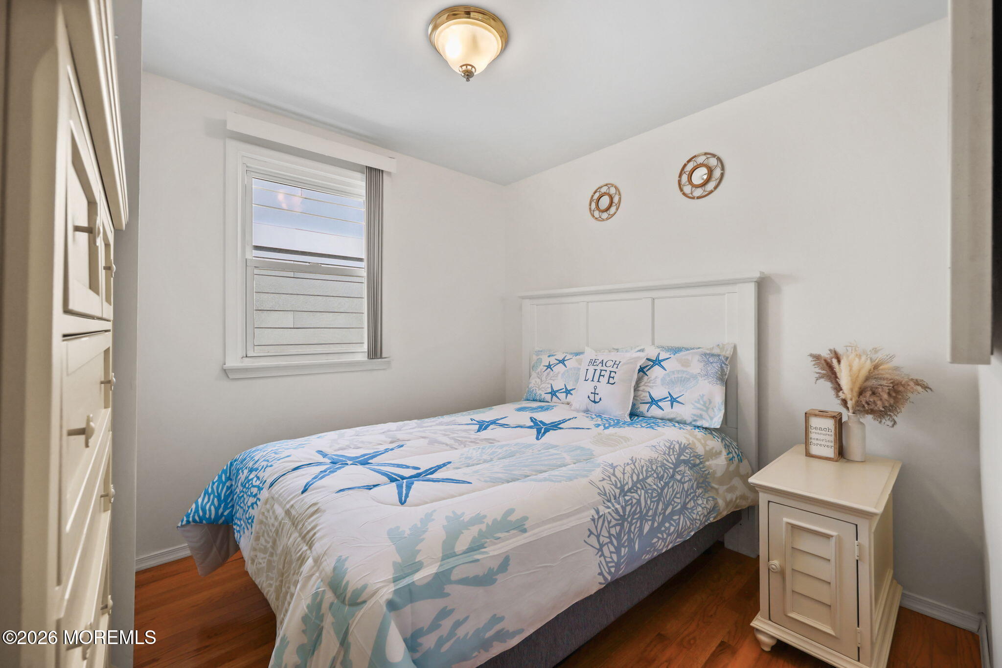 211 Ocean Avenue Point Pleasant Beach, NJ 08742 - Photo 23 of 60 a bedroom with a bed and window