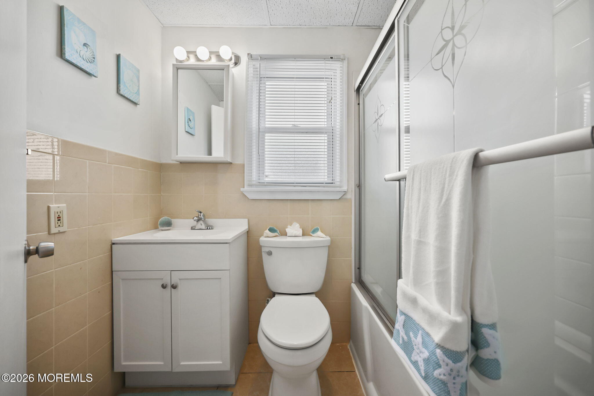 211 Ocean Avenue Point Pleasant Beach, NJ 08742 - Photo 27 of 60 a bathroom with a toilet sink and mirror