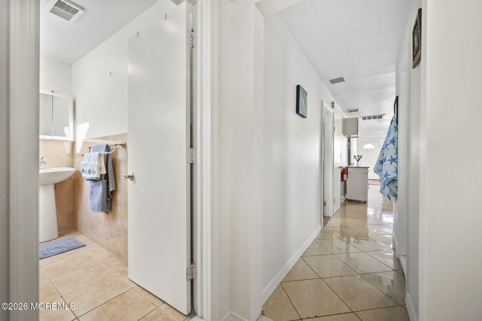 211 Ocean Avenue Point Pleasant Beach, NJ 08742 - Photo 29 of 60 a view of a kitchen from the hallway