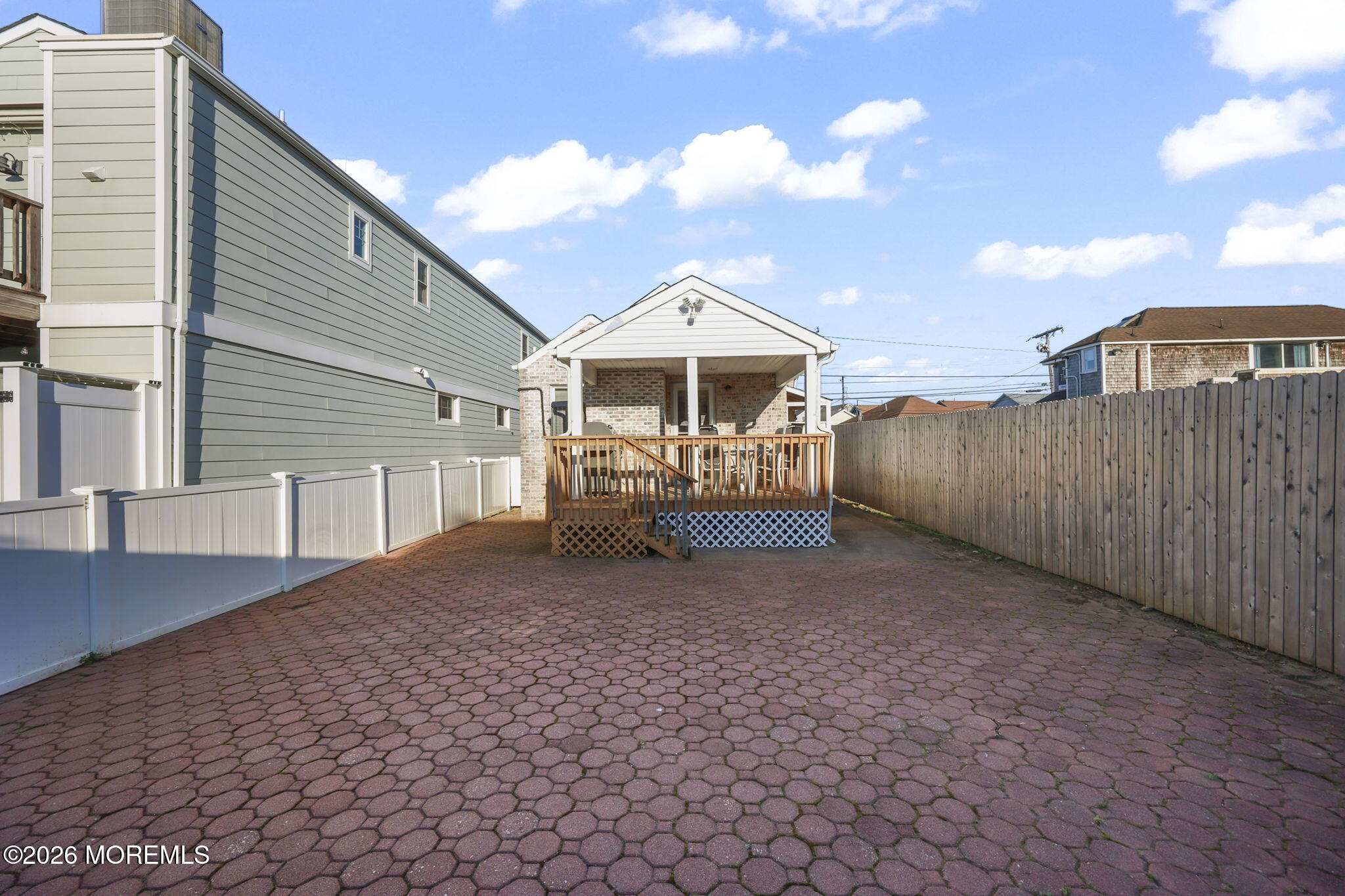 211 Ocean Avenue Point Pleasant Beach, NJ 08742 - Photo 38 of 60 a view of a grey house with a yard
