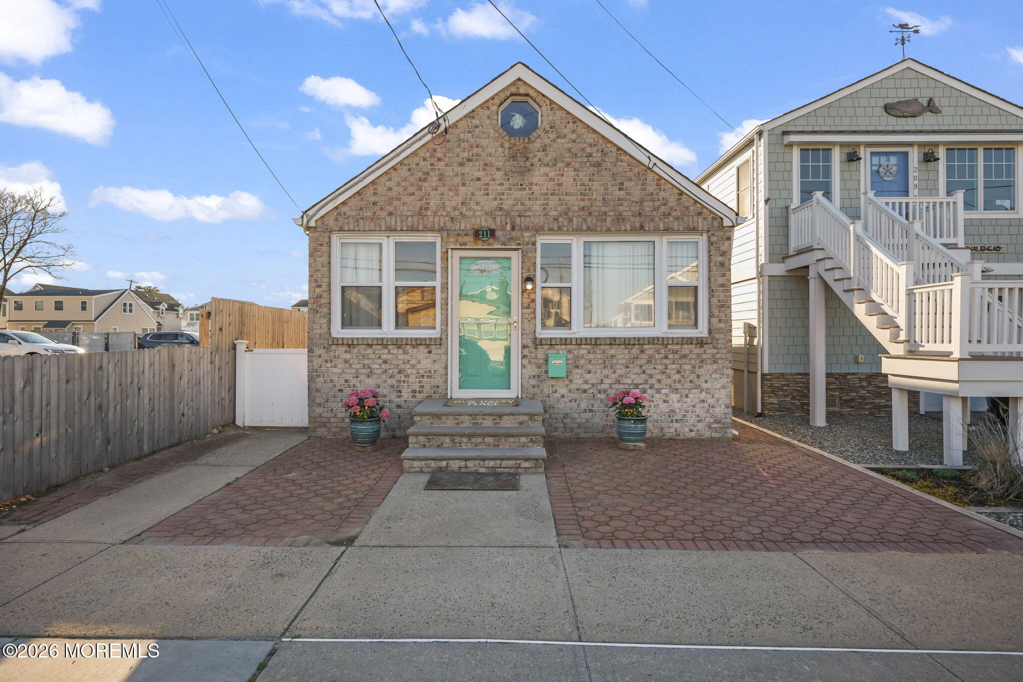 211 Ocean Avenue Point Pleasant Beach, NJ 08742 - Photo 9 of 60 a front view of a house with a yard