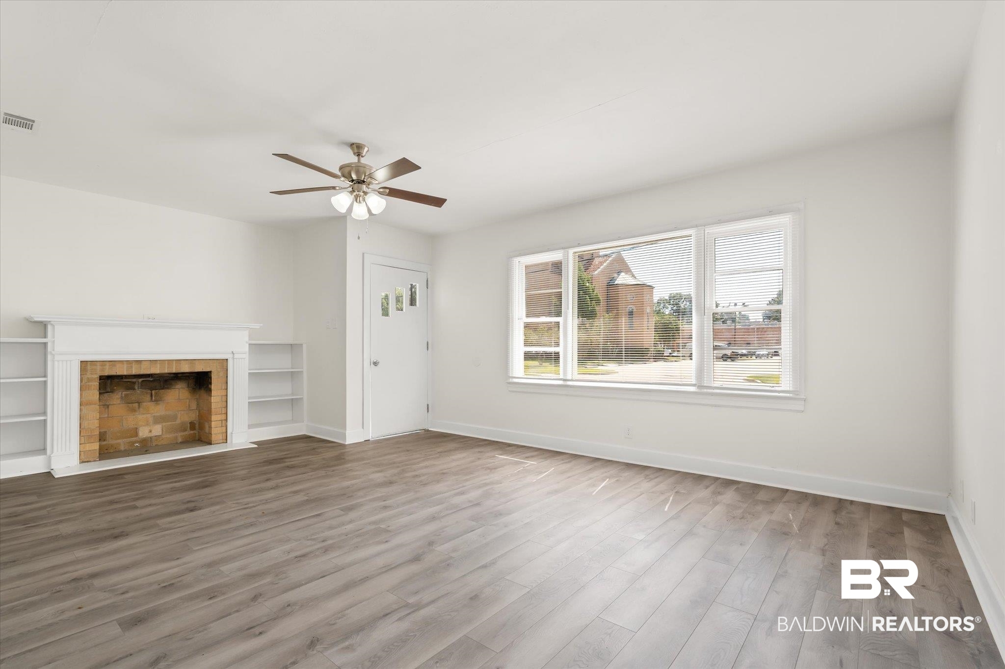 1306 Azalea Street Mobile, AL 36604 - Photo 2 of 20 Unfurnished living room featuring hardwood / wood-style flooring and ceiling fan